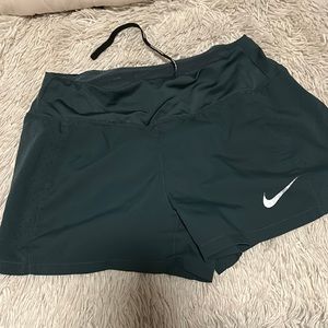 Green Nike athletic shorts